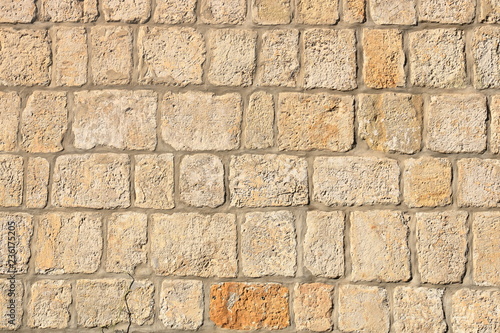 Vintage grunge stone blocks wall texture.