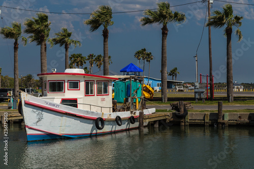 Fishing Boat and Dark Clouds photo