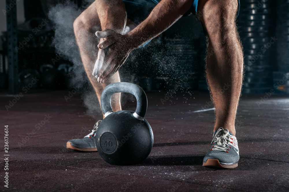 Kettlebell training in gym. Athlete doing workout