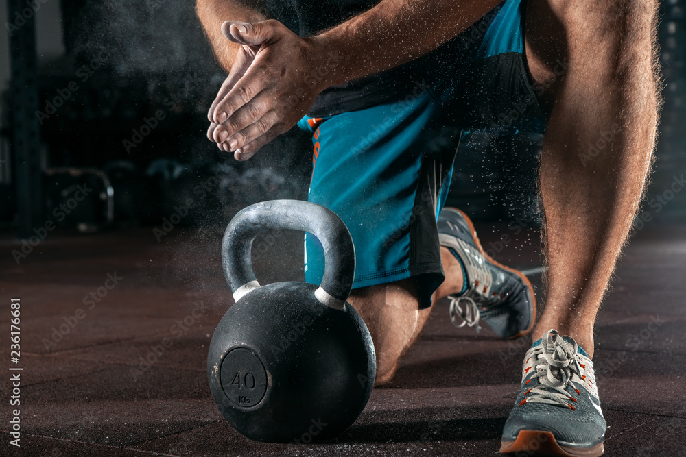 Kettlebell training in gym. Athlete doing workout