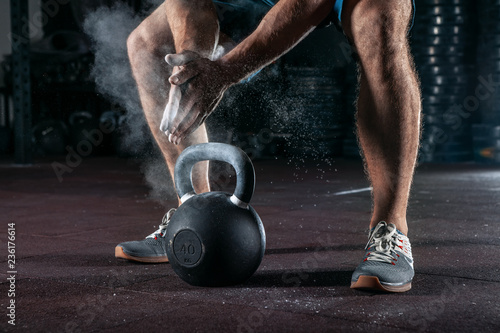 Obraz na płótnie Kettlebell training in gym. Athlete doing workout w salonie
