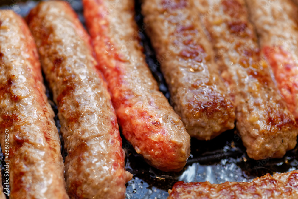 Close up grilled homemade meat sausages. Shallow depth a field Close up grilled homemade meat sausages. Shallow depth a field