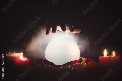 Crystal ball on the magic table background. Future reading. photo