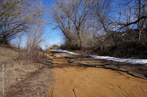 View of the ravine edge formed from sandy-clay rock photo