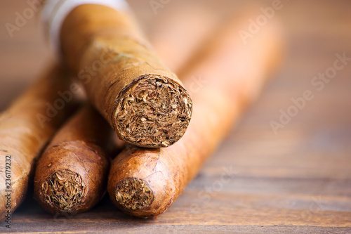 Cuban cigars on wooden table close up photo