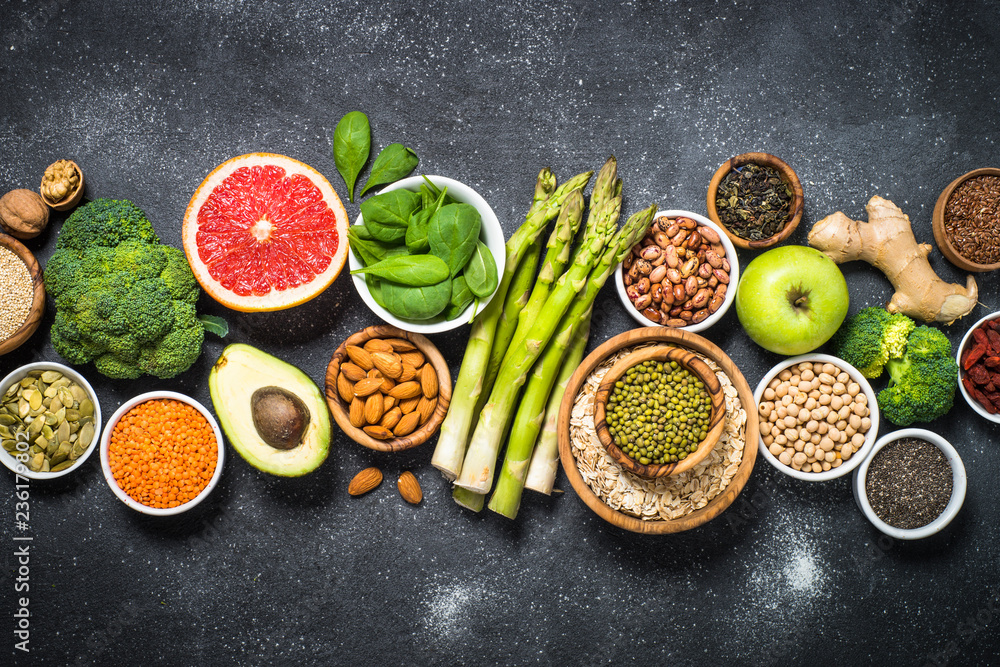 Superfoods on black stone background. Superfoods on black stone background.
