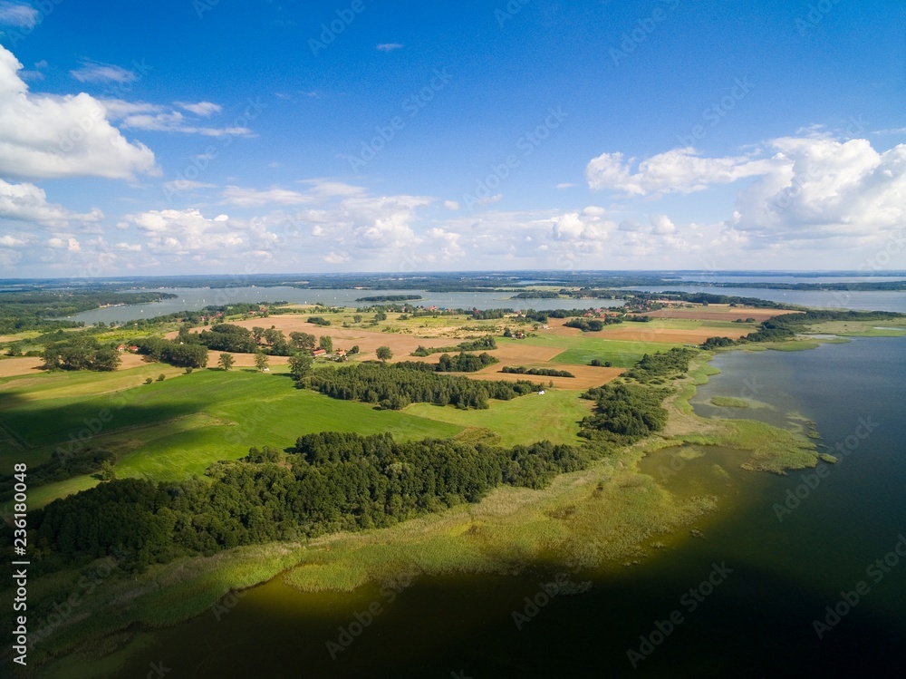 Aerial view of beautiful landscape of lake district, Mamry Lake in the foreground, Swiecajty Lake in the background, Mazury, Poland