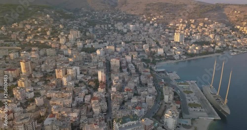 Aerial view of Saranda port and an expensive yacht parked (Yacht A).  Cityscape of Sarande, Albania 