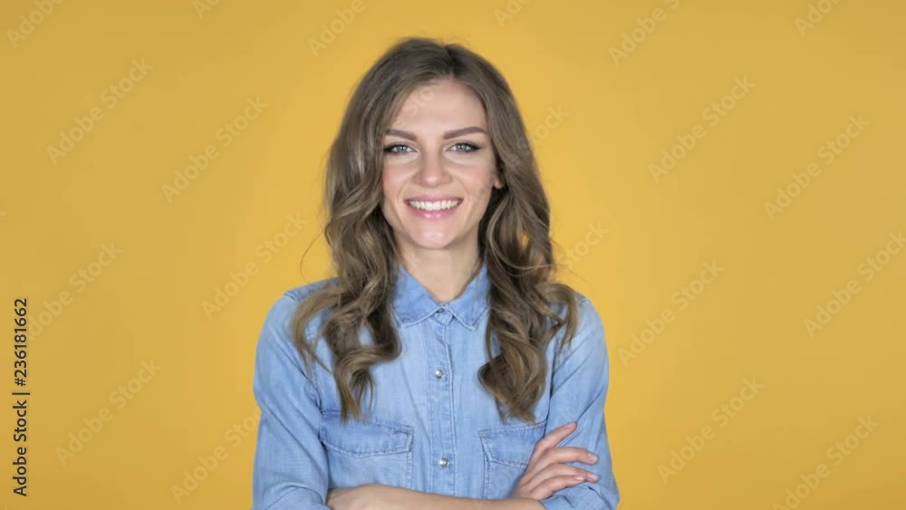 Yes, Young Girl Shaking Head to Accept Isolated on Yellow Background Yes, Young Girl Shaking Head to Accept Isolated on Yellow Background