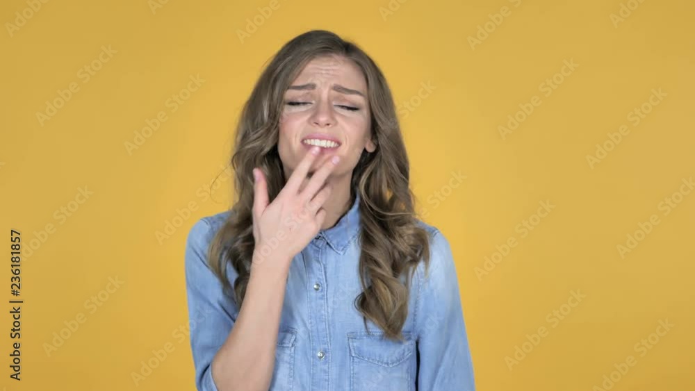 Young Girl Gesturing Failure and Problems Isolated on Yellow Background Young Girl Gesturing Failure and Problems Isolated on Yellow Background