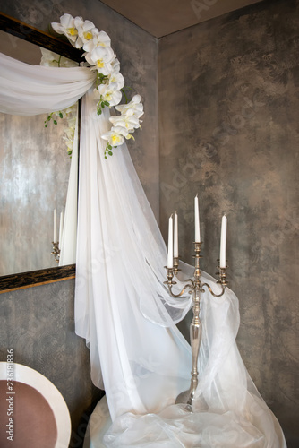 wedding vintage decor with veils, candles and orchids - vertical orientation