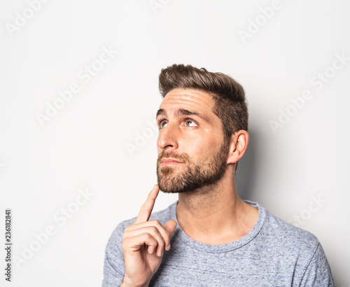 A nice guy in studio white, pointing something