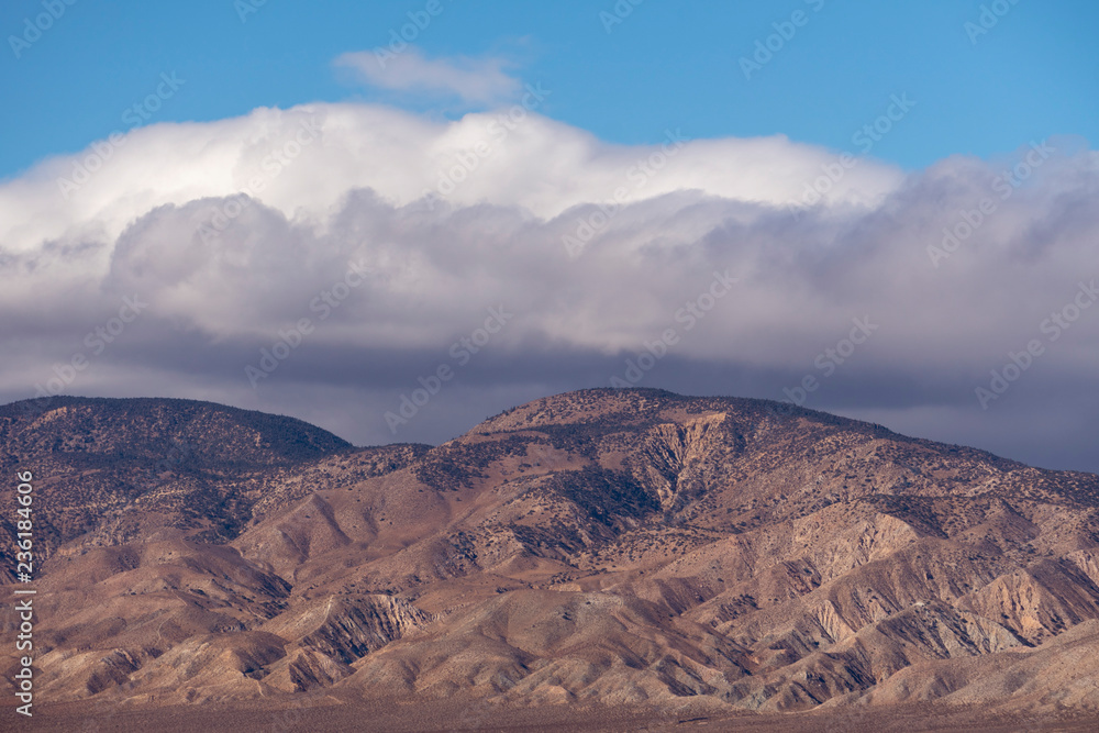 storm clouds over desert mountains