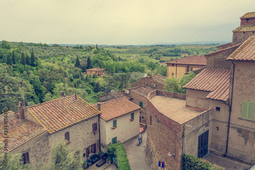 Rooftop view of tuscany countryside with traditional architecture and nature. Rooftop view of tuscany countryside with traditional architecture and nature.