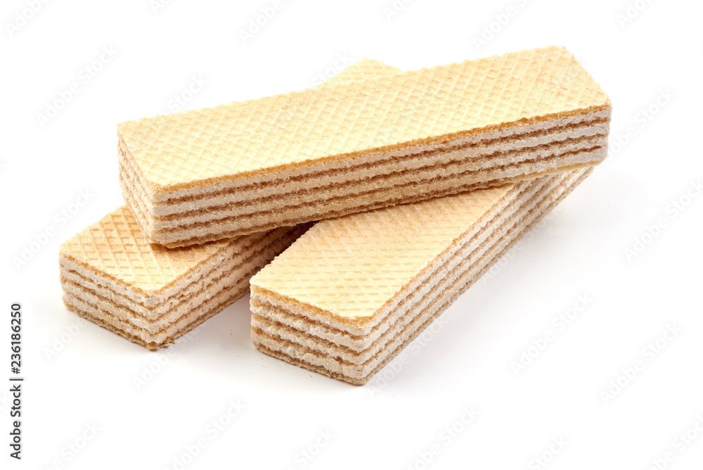 Crunchy vanilla waffles, isolated on a white background. Close-up. Crunchy vanilla waffles, isolated on a white background. Close-up.