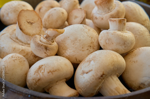 Champignon mushrooms in a cast iron skillet