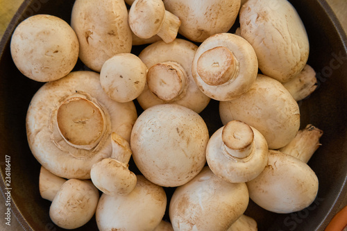 Champignon mushrooms in a cast iron skillet