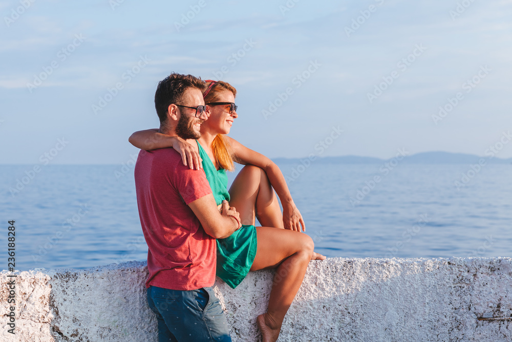 Young couple in love enjoying their honeymoon at the seaside Young couple in love enjoying their honeymoon at the seaside