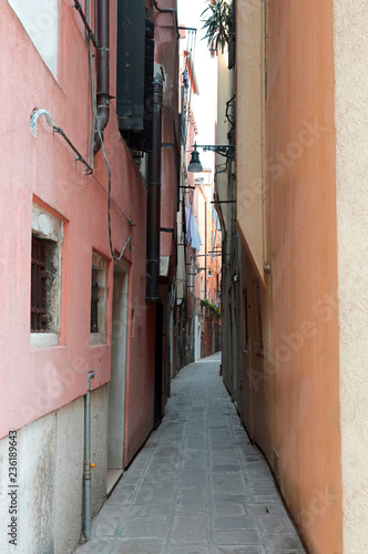 very narrow alley in the island of Venice in Italy