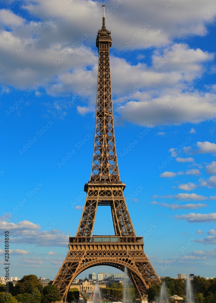 high eiffel tower with very bright colors and white clouds in th