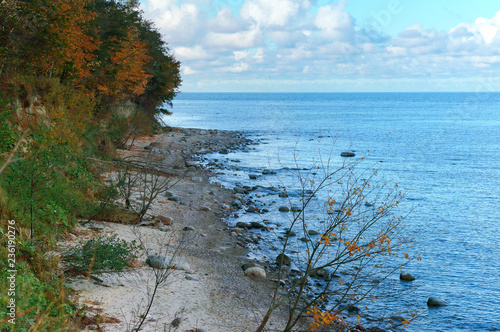 Autumn landscape on the sea. Autumn on the coast. The calm sea. Turquoise seascape. Sea smoothness.