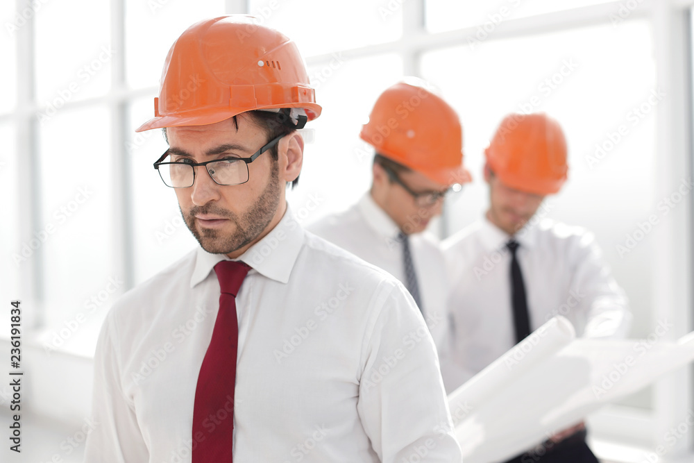 close up.engineer Builder in a protective helmet close up.engineer Builder in a protective helmet