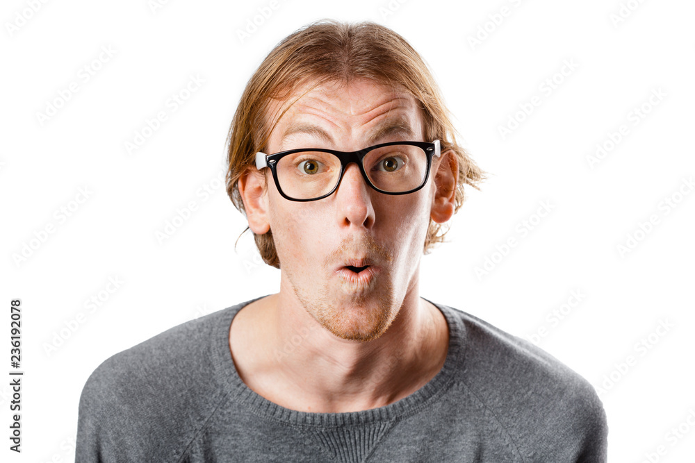 Male portrait of a fair-haired man of European appearance, on a white background. Emotions. Nerd hipster in eyeglasses sitting on a chair. Young worried nerd man. Stupid face. Botanist. Man in glasses Male portrait of a fair-haired man of European appearance, on a white background. Emotions. Nerd hipster in eyeglasses sitting on a chair. Young worried nerd man. Stupid face. Botanist. Man in glasses