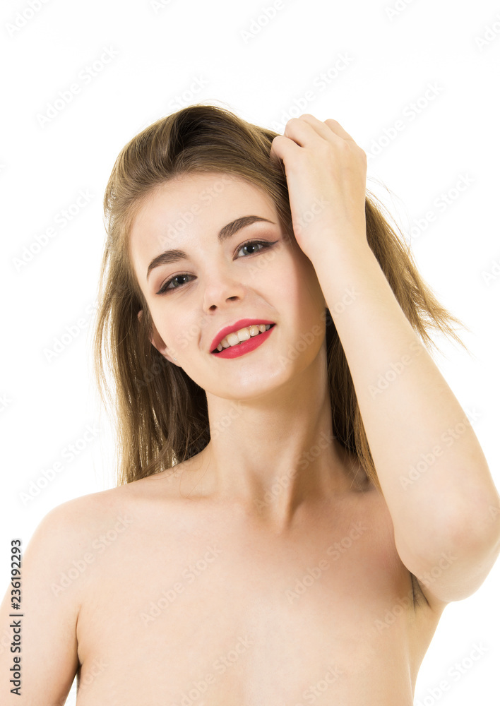 Portrait of a naked young, smiling woman with long hair and makeup. Portrait of a naked young, smiling woman with long hair and makeup.