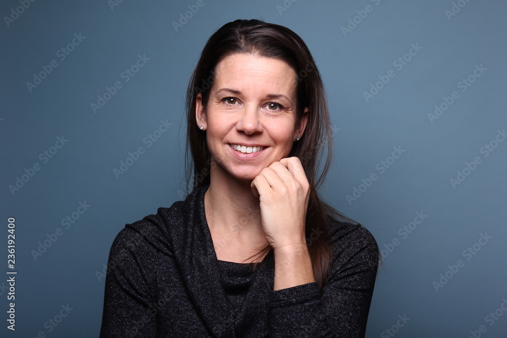 Portrait of a woman in front of a colored background Portrait of a woman in front of a colored background