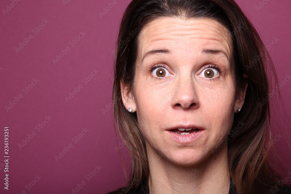 Portrait of a woman in front of a colored background Portrait of a woman in front of a colored background