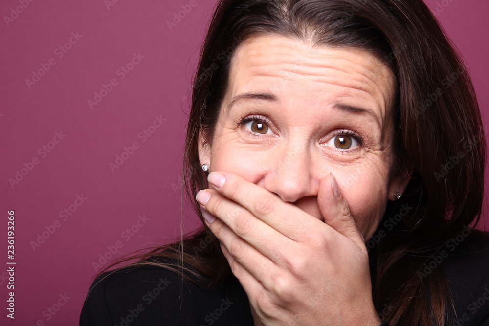 Portrait of a woman in front of a colored background Portrait of a woman in front of a colored background