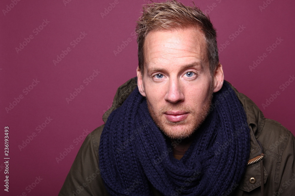 Portrait of a man in front of a colored background Portrait of a man in front of a colored background