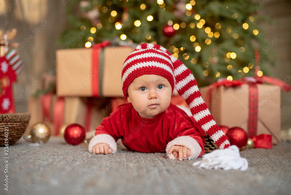The little girl under the Christmas tree The little girl under the Christmas tree