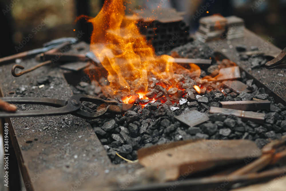 Forge, brazier with very hot coals, close-up. Forge, brazier with very hot coals, close-up.