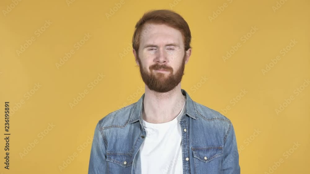 Redhead Man Waving Finger to Refuse Isolated on Yellow Background Redhead Man Waving Finger to Refuse Isolated on Yellow Background