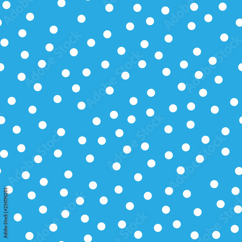 Snowy seamless patern. White dot snowflakes on blue background. Snow and Christmas theme. Abstract backround. © pyty