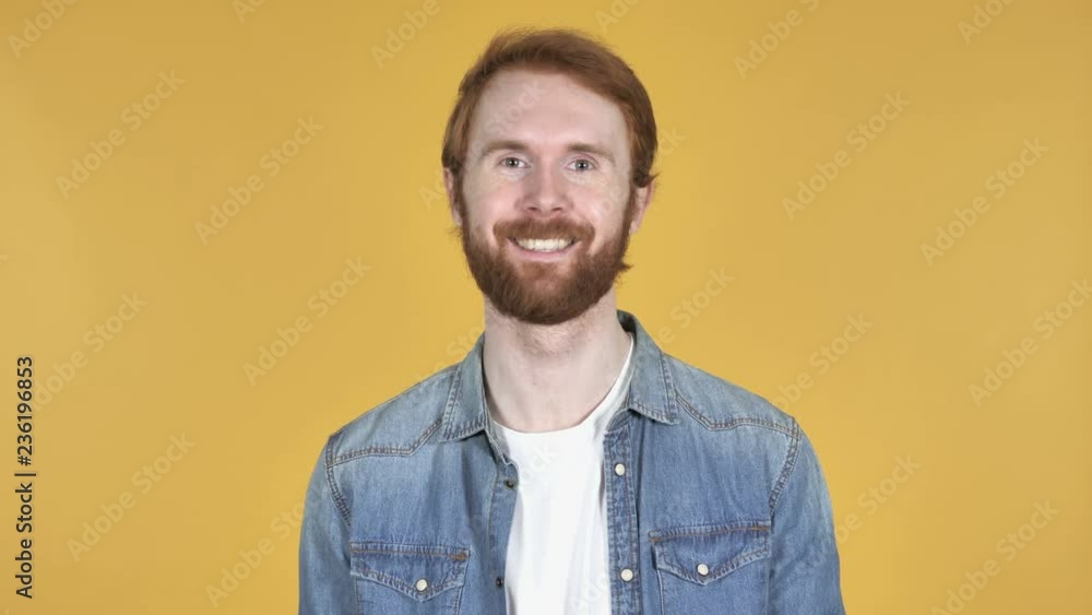 Flying Kiss by Redhead Man Isolated on Yellow Background Flying Kiss by Redhead Man Isolated on Yellow Background