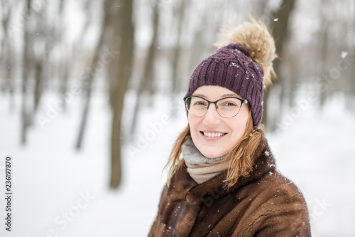 Portrait of young woman during walk at winter