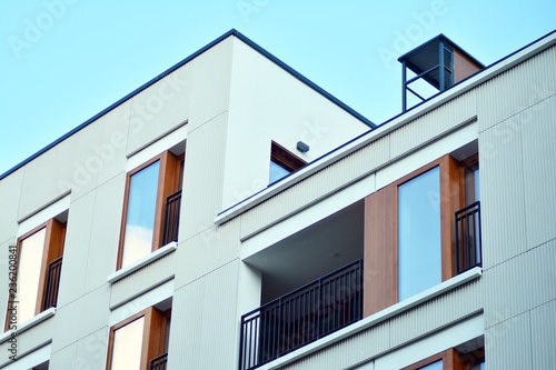 Modern apartment buildings on a sunny day with a blue sky. Facade of a modern apartment building