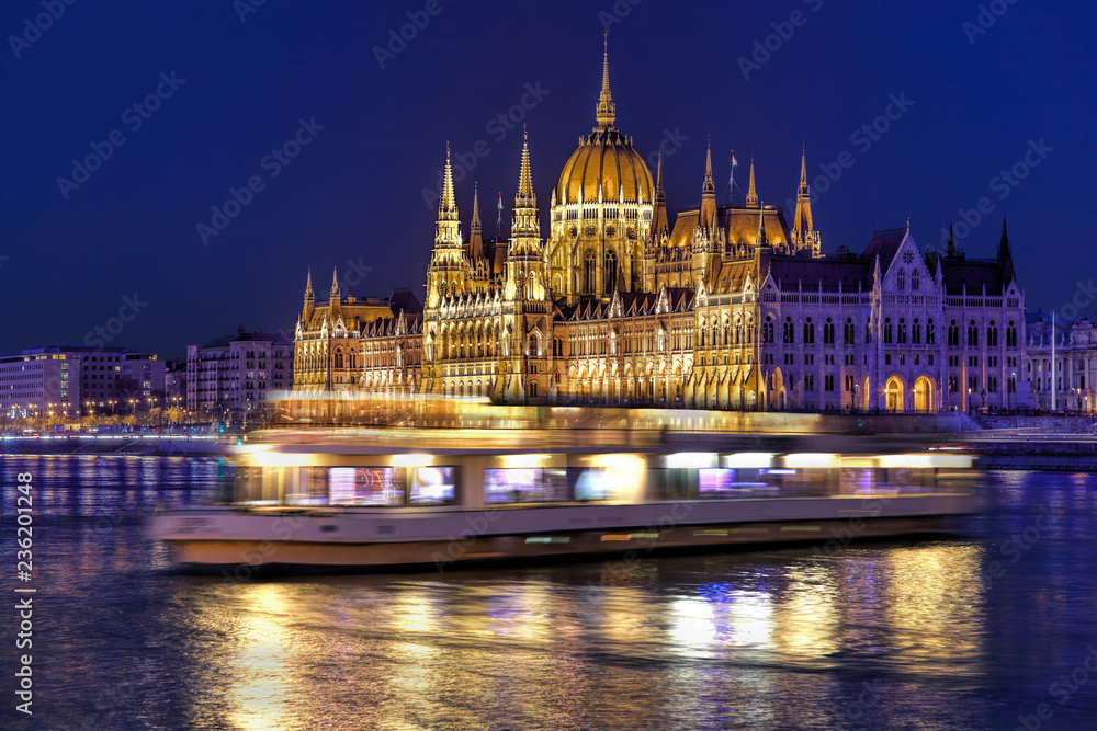 Fototapeta premium Parliament building of Budapest above Danube river in Hungary at night.
