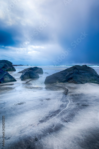 Line of Large Stones on Skagsanden Beach in Norway During Spring Time