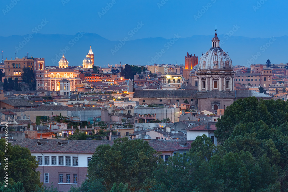 Aerial wonderful view of Rome with roofs and churches at sunset time in Rome, Italy