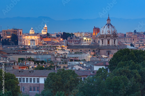 Aerial wonderful view of Rome with roofs and churches at sunset time in Rome, Italy