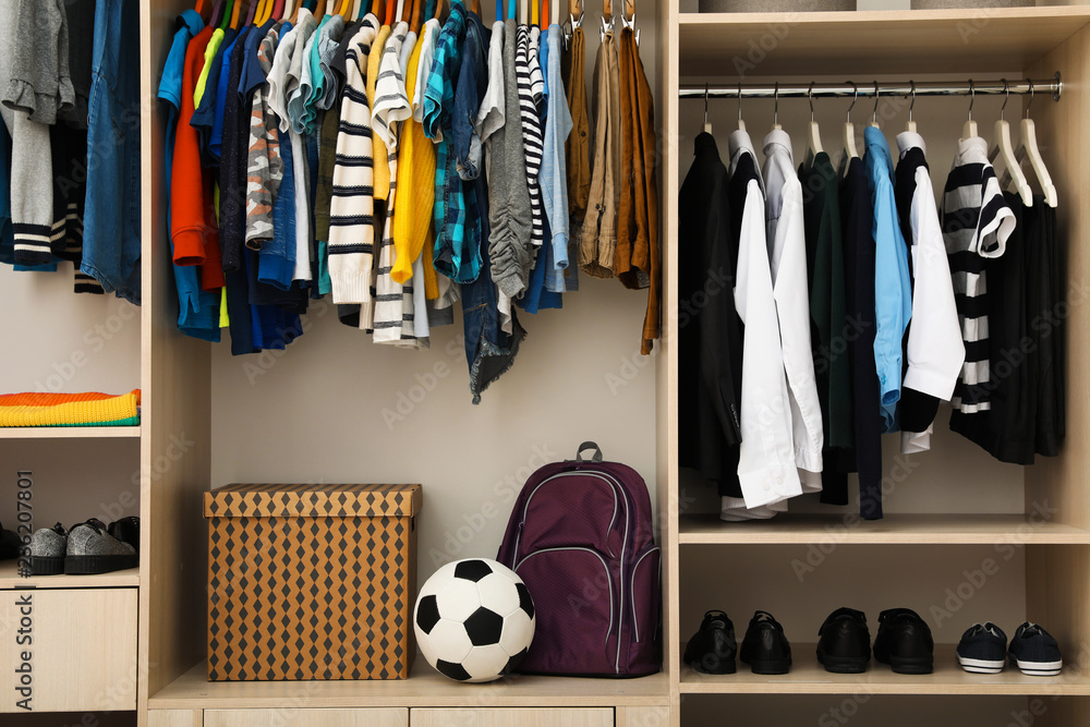 Obraz premium Large wardrobe with teenager clothes, shoes and accessories