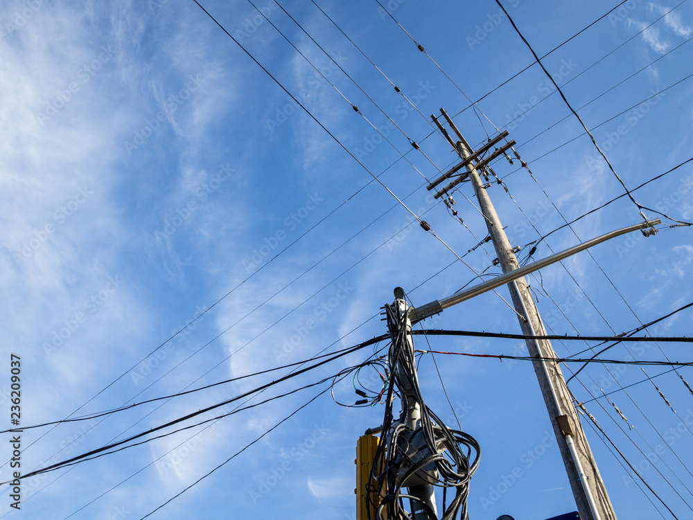 Electric power line, old and outdated, on a rotten wooden pole, abiding by North American standards, in the city of Ottawa, Ontario, Canada Electric power line, old and outdated, on a rotten wooden pole, abiding by North American standards, in the city of Ottawa, Ontario, Canada
