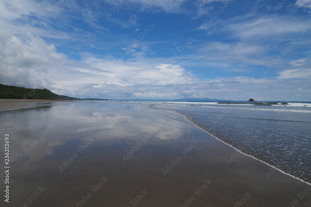 The beach at Playa Hemosa on the Pacific coast of Nicaragua, Central America on a summer afternoon.