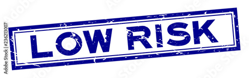 Grunge blue low risk word square rubber seal stamp on white background