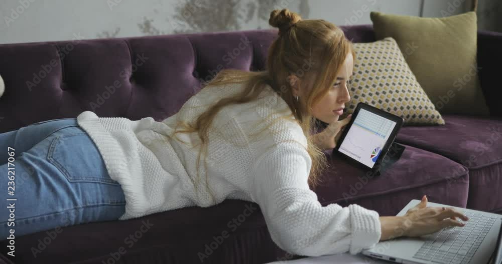 Young woman using digital tablet computer in home Young woman using digital tablet computer in home