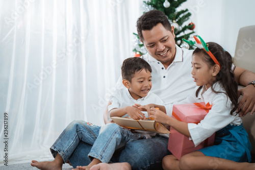 family gift exchange during christmas photo