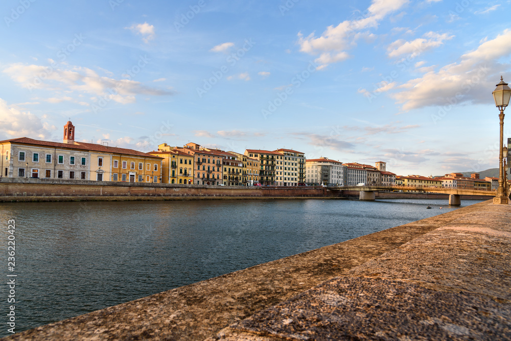 View on embankment of Arno river and Solferino bridge. Pisa, Italy